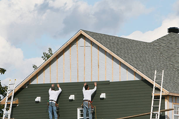 Professional Emergency Siding Repair technician working in Laura, OH
